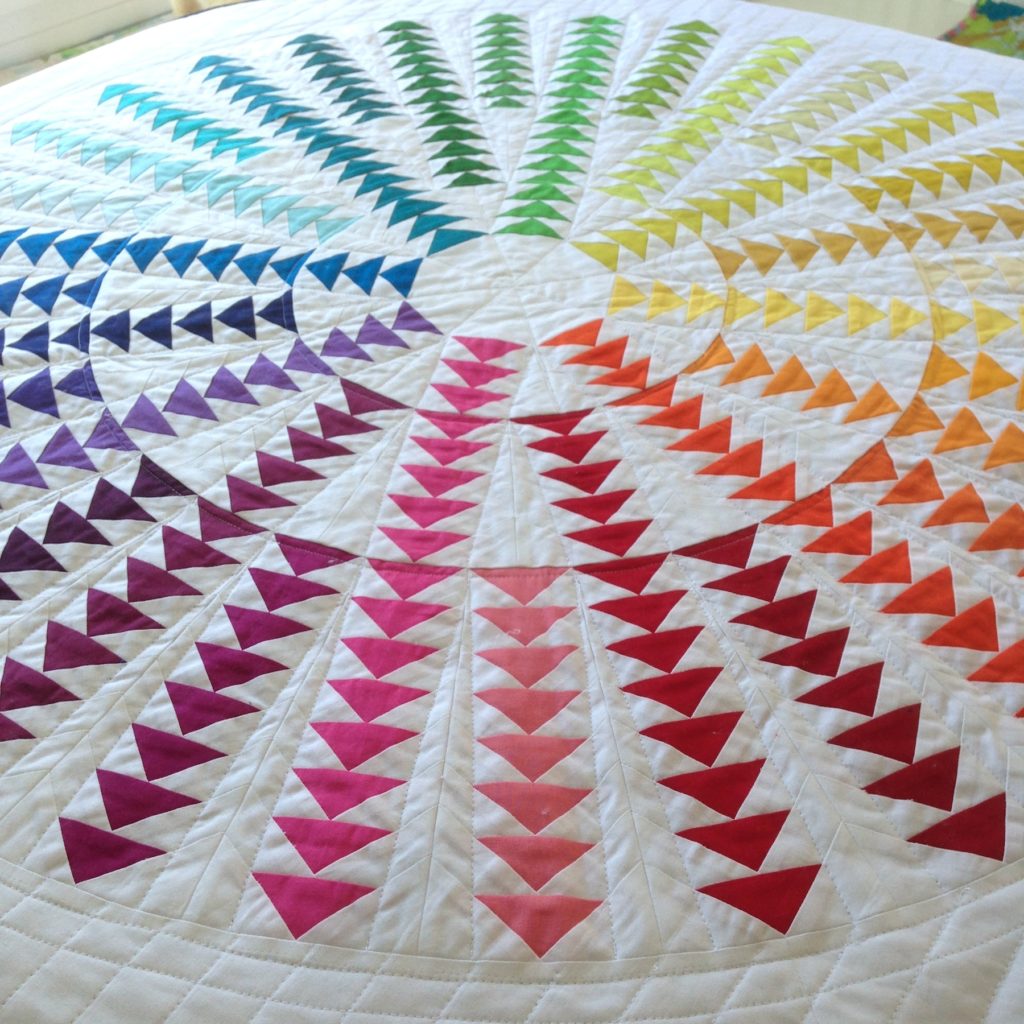 Gaggle of Geese Quilt Pattern, a rainbow circle of flying geese