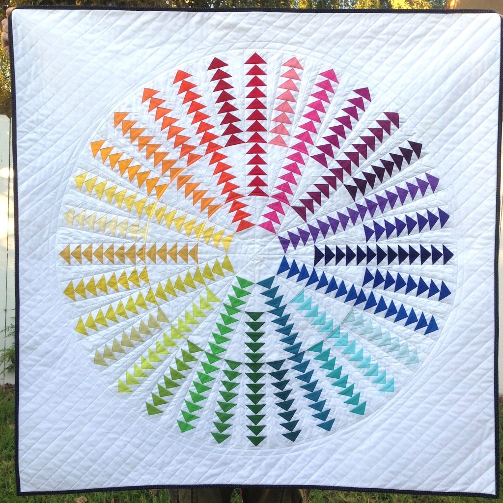 Gaggle of Geese Quilt Pattern, a rainbow circle of flying geese